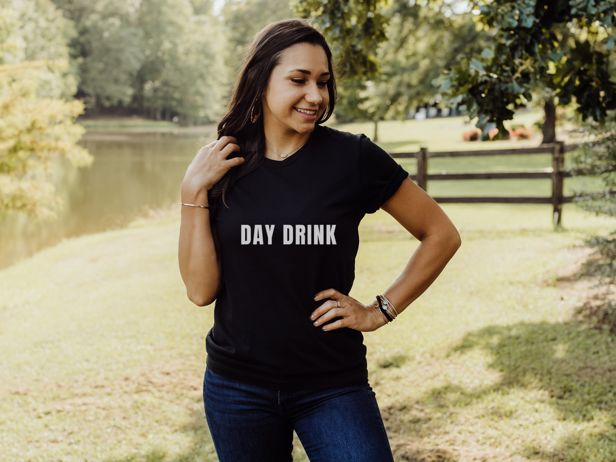 Day Drink Bella & canvas black T paired with medium washed jeans.