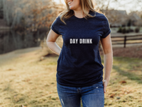 Day Drink Bella & canvas heather navy T paired with medium washed jeans.