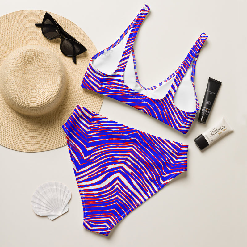 Back of Zubaz Buffalo bikini paired with black sunglasses and a wide brimmed sun hat.