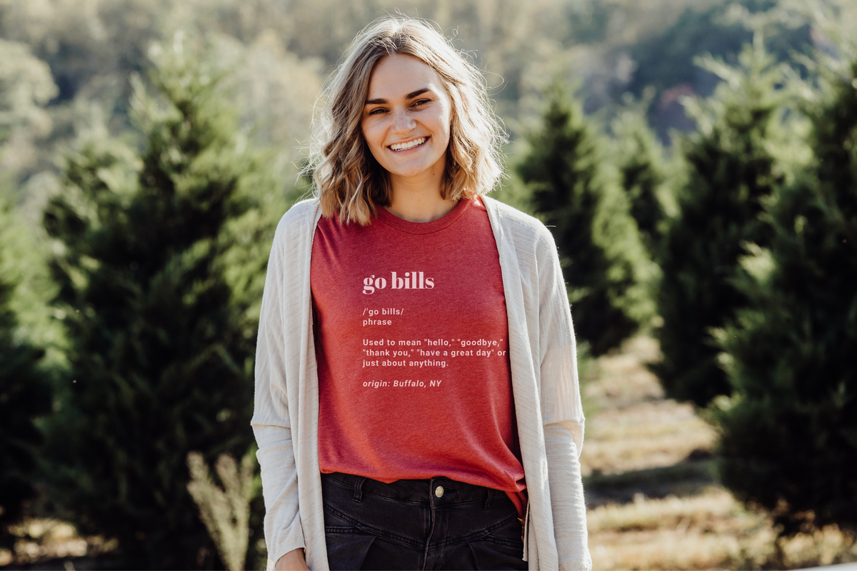 Go Bills definition tee in heather red paired with a dark wash jean and a cream cardigan. 