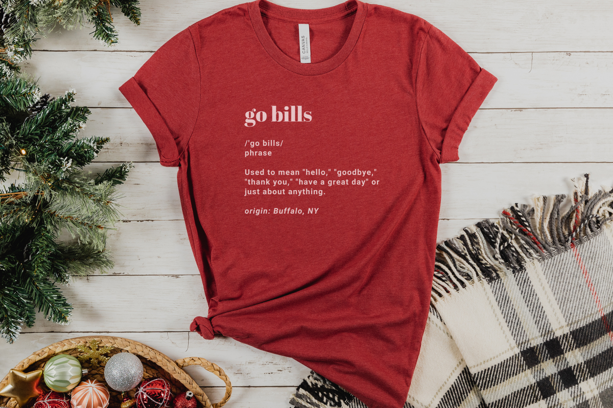 Go Bills definition tee in heather red paired with a plaid scarf. 