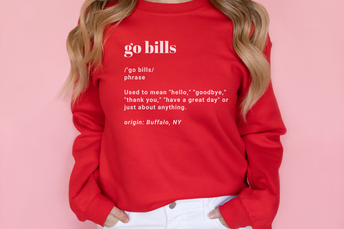 Go Bills definition crewneck sweatshirt in red paired with light wash jeans.