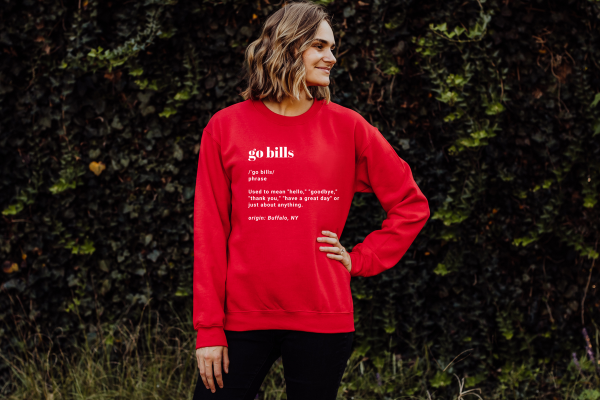 Go Bills definition crewneck sweatshirt in red paired with dark wash jeans. 