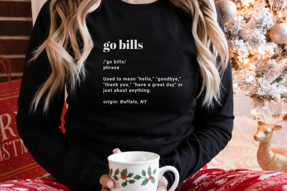 Unisex Go Bills definition long sleeve in black paired with red winter pajama pants.