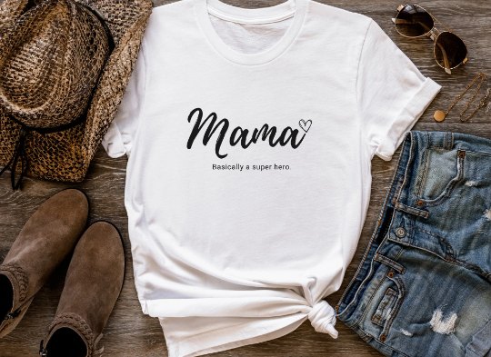 Mama tee shirt paired with a snakeskin cowboy hat, brown booties and light wash jean shorts.