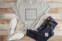 "Ma Bruh" t-shirt in Athletic heather paired with medium wash jeans and white sneakers.